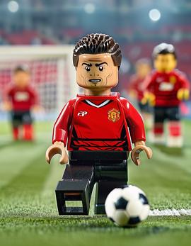 Cristiano Ronaldo as a figure built with Lego® bricks in his iconic free-kick stance, wearing Manchester United jersey.